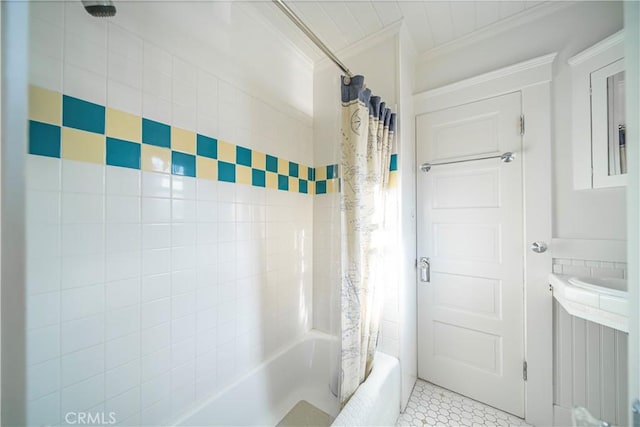 bathroom featuring tile patterned flooring, crown molding, and shower / tub combo with curtain