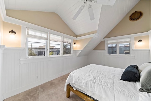 carpeted bedroom featuring ceiling fan and vaulted ceiling