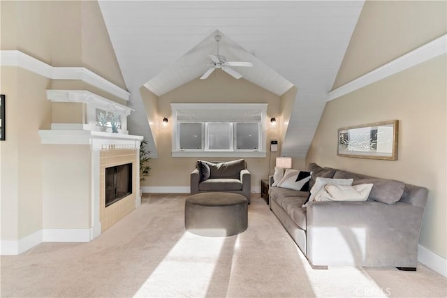 living room featuring ceiling fan, light colored carpet, and a tile fireplace