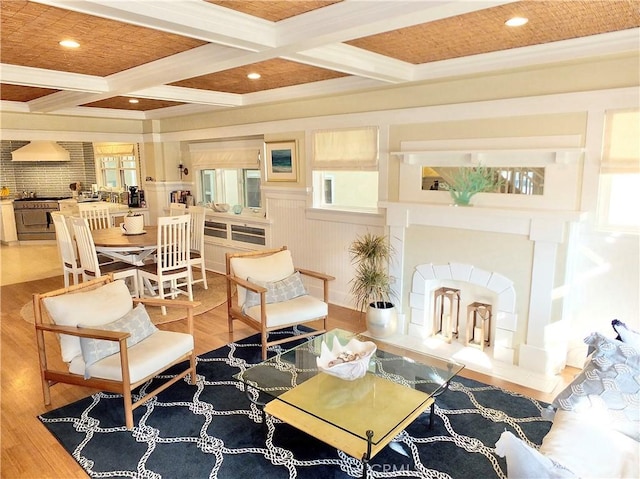 sitting room featuring hardwood / wood-style flooring, crown molding, beamed ceiling, and coffered ceiling