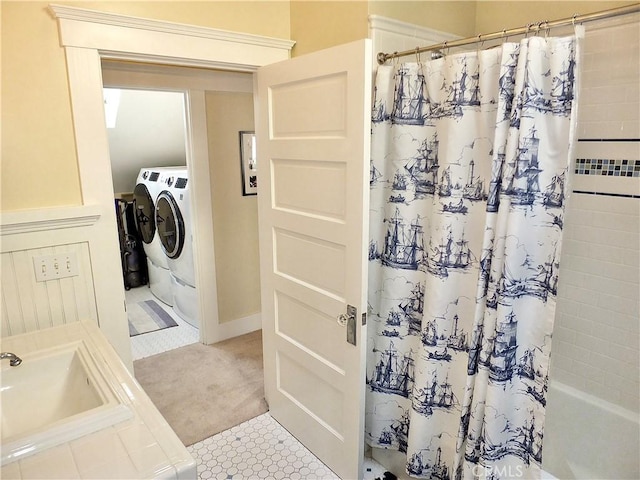 bathroom with washer and clothes dryer, vanity, and shower / bath combo with shower curtain