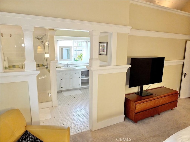 interior space featuring sink and crown molding