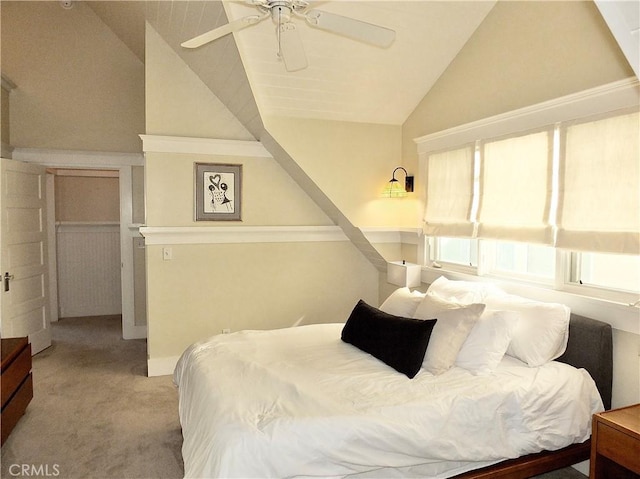 carpeted bedroom featuring ceiling fan and lofted ceiling