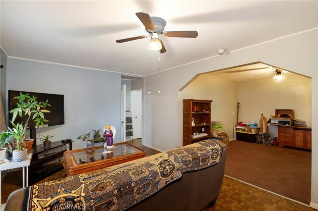 living room featuring dark parquet floors and ceiling fan