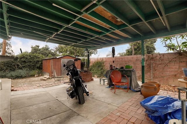 view of patio / terrace featuring a shed