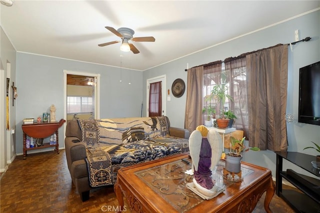 living room with ceiling fan and dark parquet floors