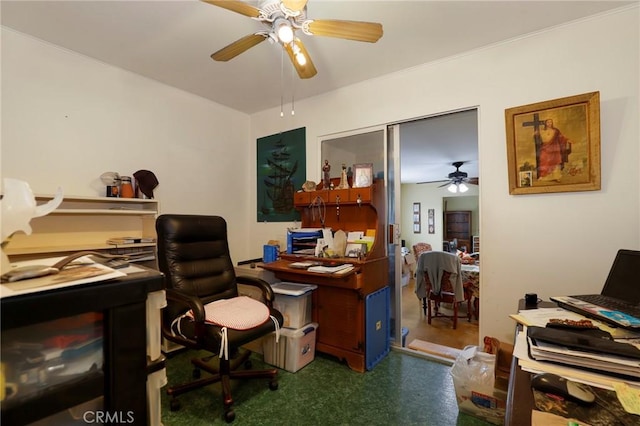 carpeted home office with ceiling fan