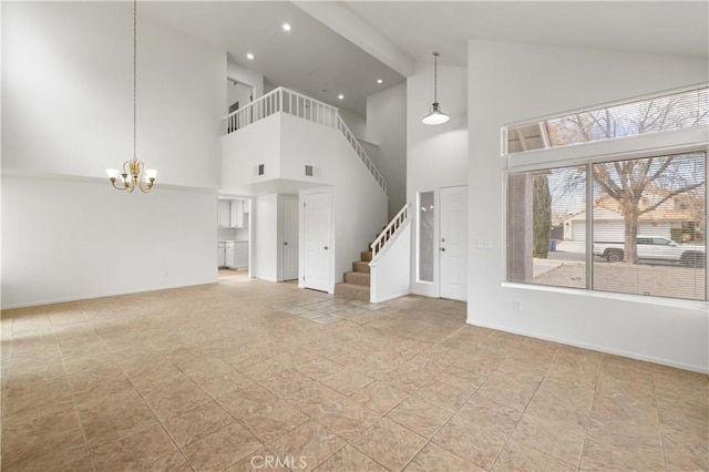 unfurnished living room featuring light tile patterned floors, beam ceiling, a towering ceiling, and an inviting chandelier