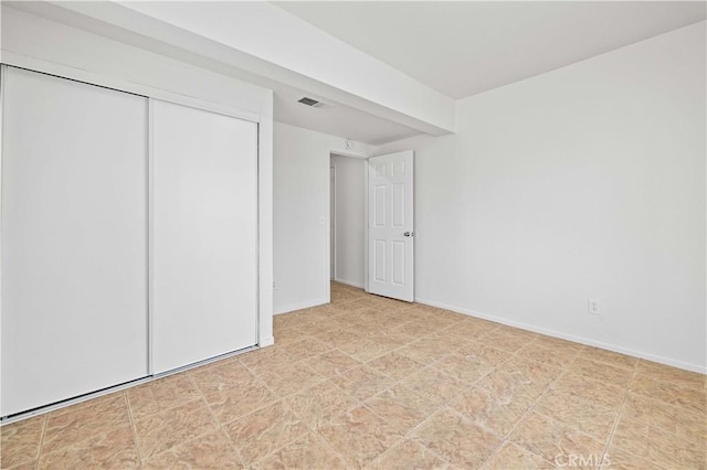 unfurnished bedroom featuring a closet