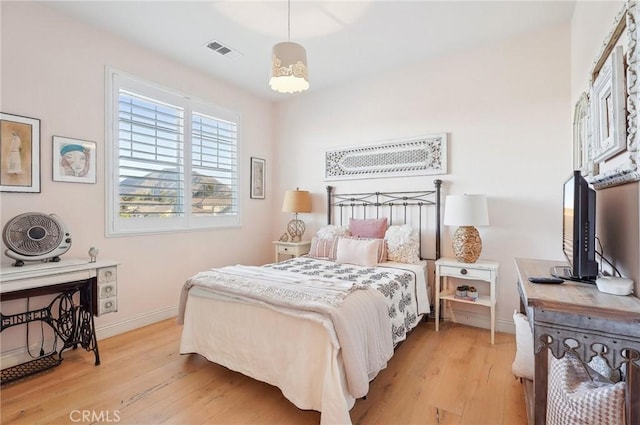 bedroom with light hardwood / wood-style floors