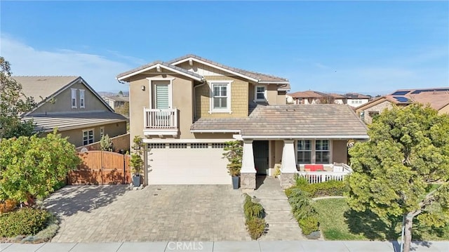 view of front of home featuring a garage and a porch