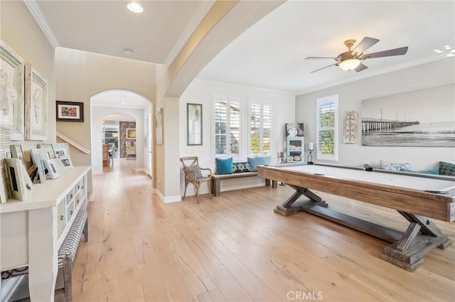 recreation room featuring ceiling fan, billiards, ornamental molding, and light hardwood / wood-style flooring