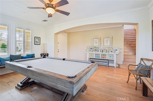 recreation room with light wood-type flooring, ceiling fan, ornamental molding, and pool table