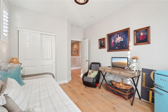 bedroom featuring light wood-type flooring and a closet