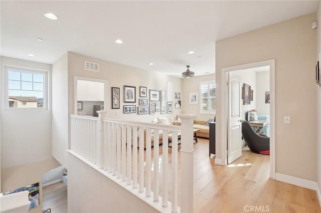 hall with light hardwood / wood-style floors