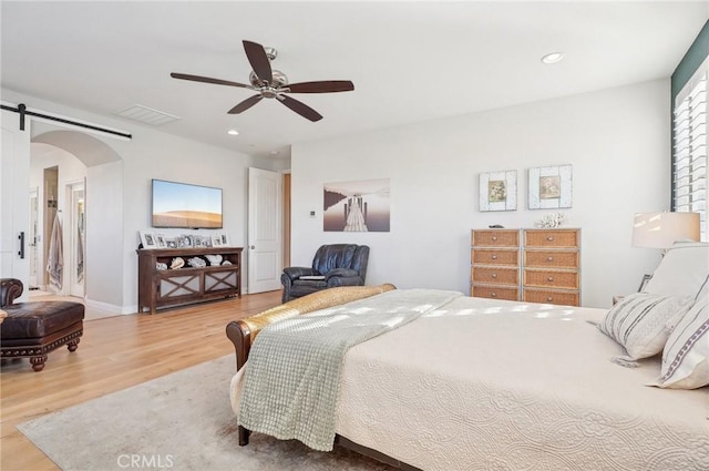 bedroom featuring ceiling fan and light hardwood / wood-style floors