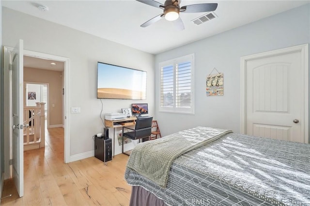 bedroom with ceiling fan and light hardwood / wood-style flooring