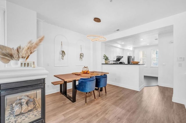 dining space featuring light hardwood / wood-style flooring