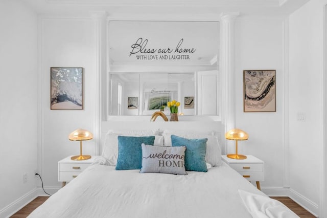 bedroom featuring dark hardwood / wood-style floors and ornamental molding