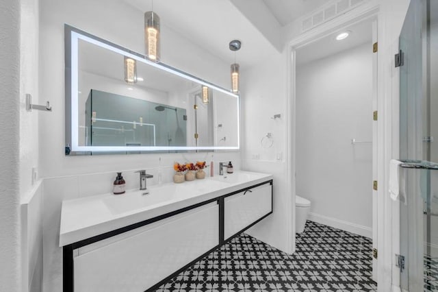 bathroom with tasteful backsplash, vanity, toilet, and walk in shower