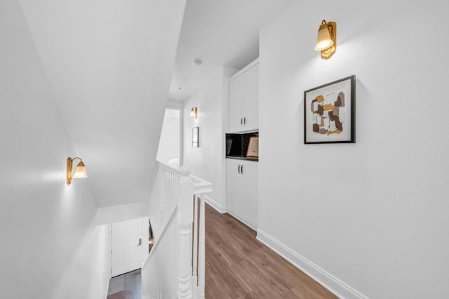 hallway featuring wood-type flooring