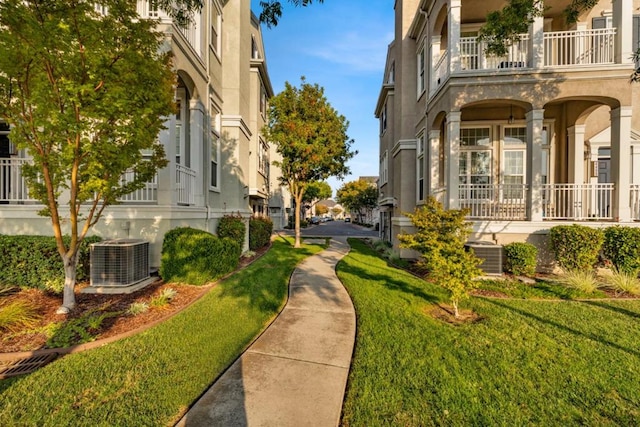 view of property's community with a lawn