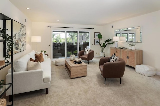 living room with light colored carpet and a wealth of natural light