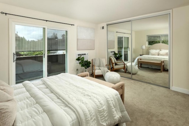 carpeted bedroom featuring access to exterior and a closet