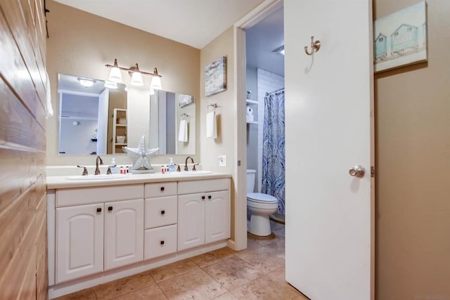 bathroom with toilet and vanity