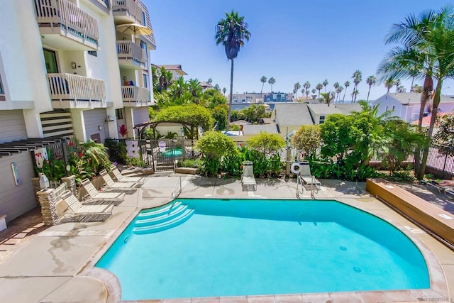 view of swimming pool with a patio