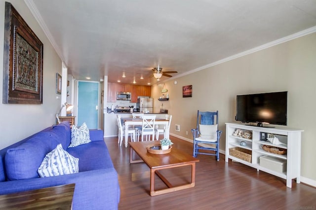 living room featuring ceiling fan, dark hardwood / wood-style floors, and ornamental molding