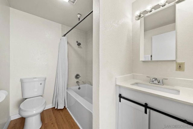 full bathroom featuring toilet, shower / tub combo, wood-type flooring, and vanity