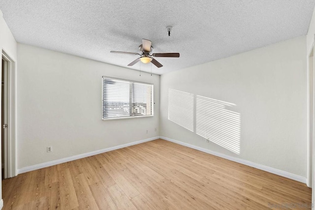 unfurnished room with a textured ceiling, ceiling fan, and light hardwood / wood-style flooring