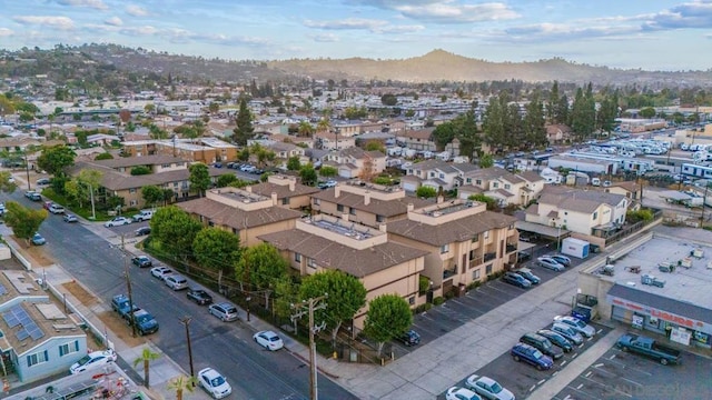 birds eye view of property featuring a mountain view