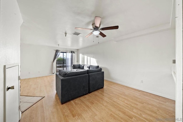 living room with ceiling fan and hardwood / wood-style flooring