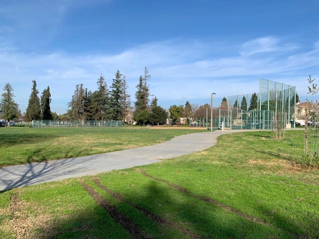 view of property's community with a lawn