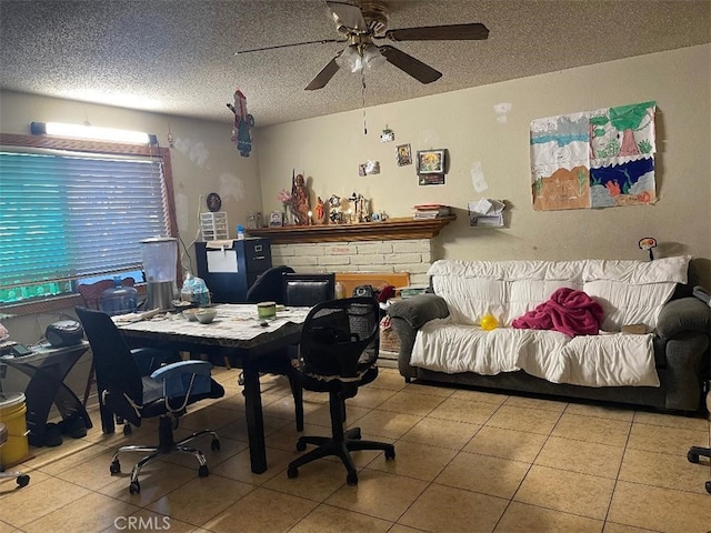 office featuring ceiling fan, a textured ceiling, and light tile patterned floors