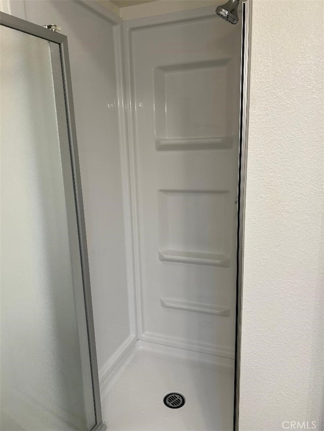 bathroom featuring a stall shower