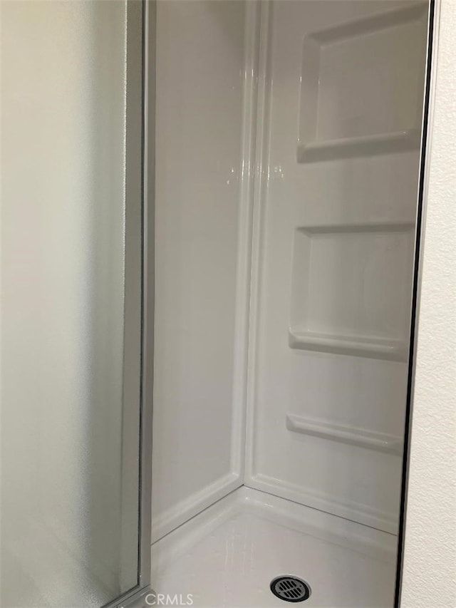 full bath featuring a stall shower