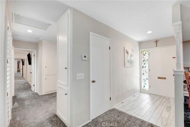 view of carpeted foyer