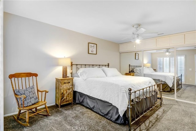 carpeted bedroom with ceiling fan and a closet