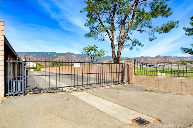 view of gate featuring a mountain view