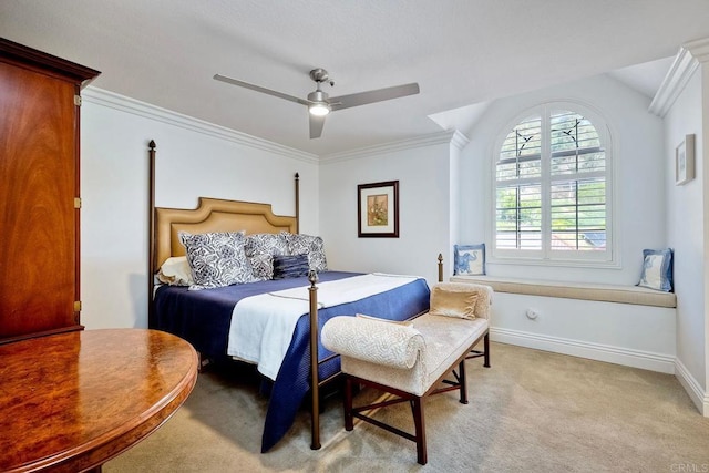 carpeted bedroom featuring crown molding and ceiling fan