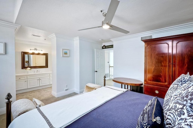 bedroom with ornamental molding, light carpet, connected bathroom, and ceiling fan