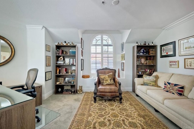 office area featuring ornamental molding, light colored carpet, and vaulted ceiling