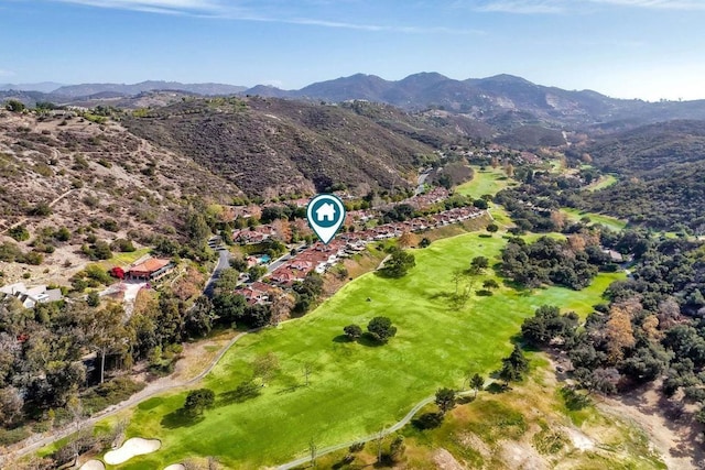 birds eye view of property featuring a mountain view