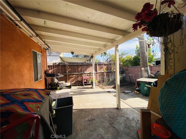 view of patio featuring fence