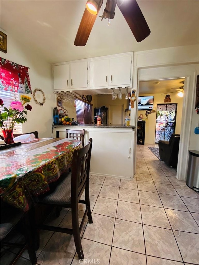 dining area with light tile patterned floors