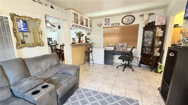 tiled home office with ceiling fan