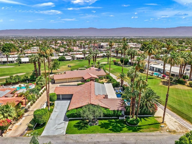 birds eye view of property with a mountain view